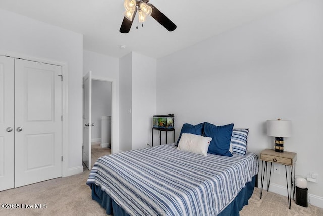 41 S Lamplighters Walk, Hampstead, NC 28443 - bedroom featuring light carpet, baseboards, ceiling fan, and a closet