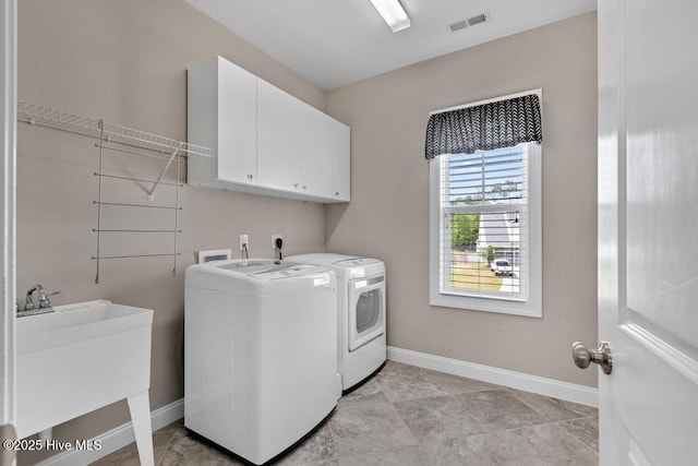 41 S Lamplighters Walk, Hampstead, NC 28443 - washroom featuring cabinet space, separate washer and dryer, and baseboards