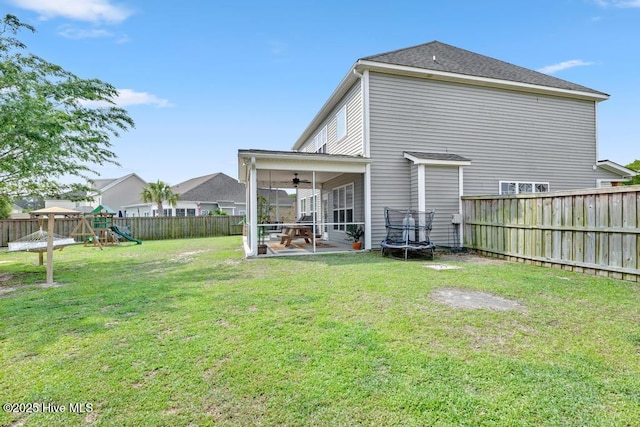 41 S Lamplighters Walk, Hampstead, NC 28443 - rear view of property with a playground, a ceiling fan, a sunroom, and a patio