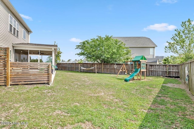 41 S Lamplighters Walk, Hampstead, NC 28443 - view of yard with a playground and a sunroom