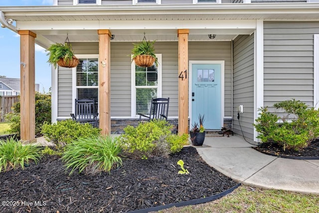 41 S Lamplighters Walk, Hampstead, NC 28443 - view of exterior entry with covered porch and stone siding