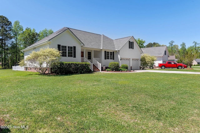 ranch-style house with a front lawn, driveway, and roof with shingles