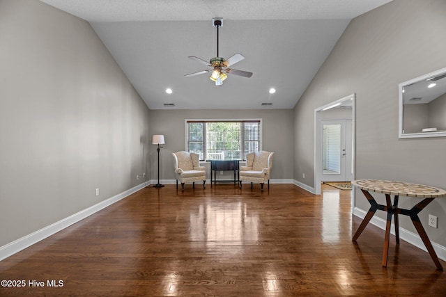 unfurnished room featuring ceiling fan, high vaulted ceiling, visible vents, wood finished floors, and baseboards