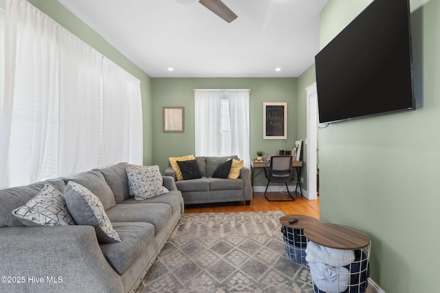 living room with ceiling fan, recessed lighting, wood finished floors, and baseboards