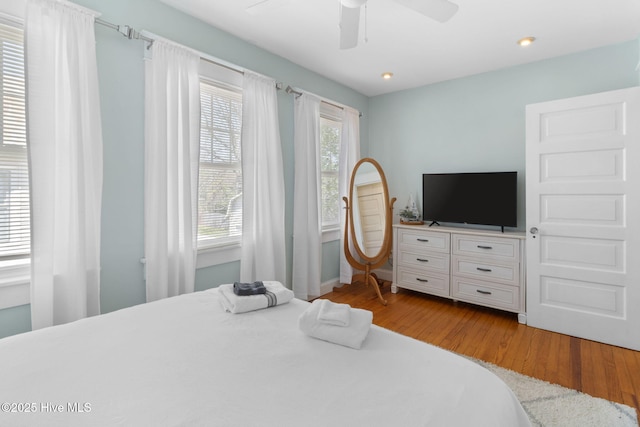 bedroom featuring ceiling fan and light wood finished floors