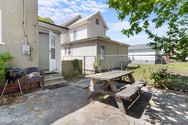 view of patio / terrace featuring outdoor dining space, a grill, and fence