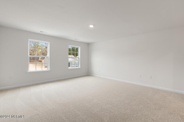 2012 Minnette Cir, New Bern, NC 28562 - unfurnished room with light carpet and baseboards