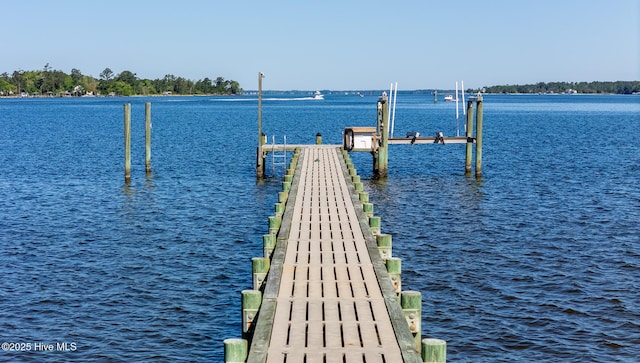 view of dock featuring boat lift and a water view