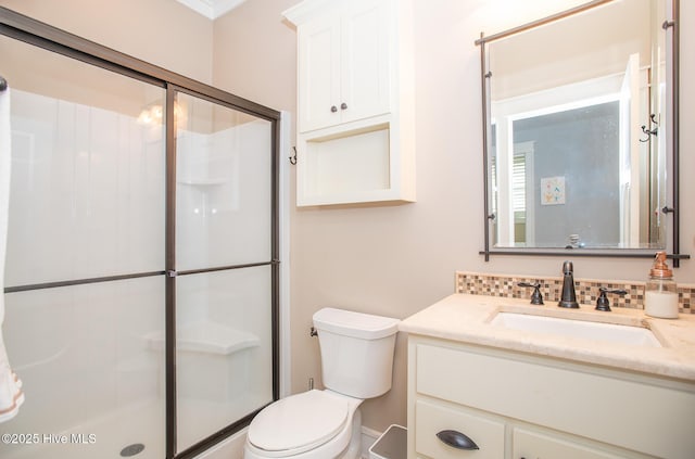 full bath featuring toilet, a shower stall, and vanity