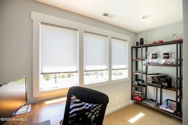 office area featuring visible vents and baseboards