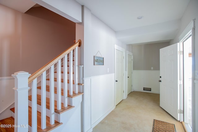 hallway featuring stairway