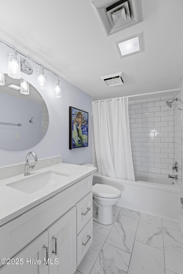 322 Causeway Dr Ste 1001, Wrightsville Beach, NC 28480 - bathroom with vanity, toilet, visible vents, shower / bath combo with shower curtain, and marble finish floor