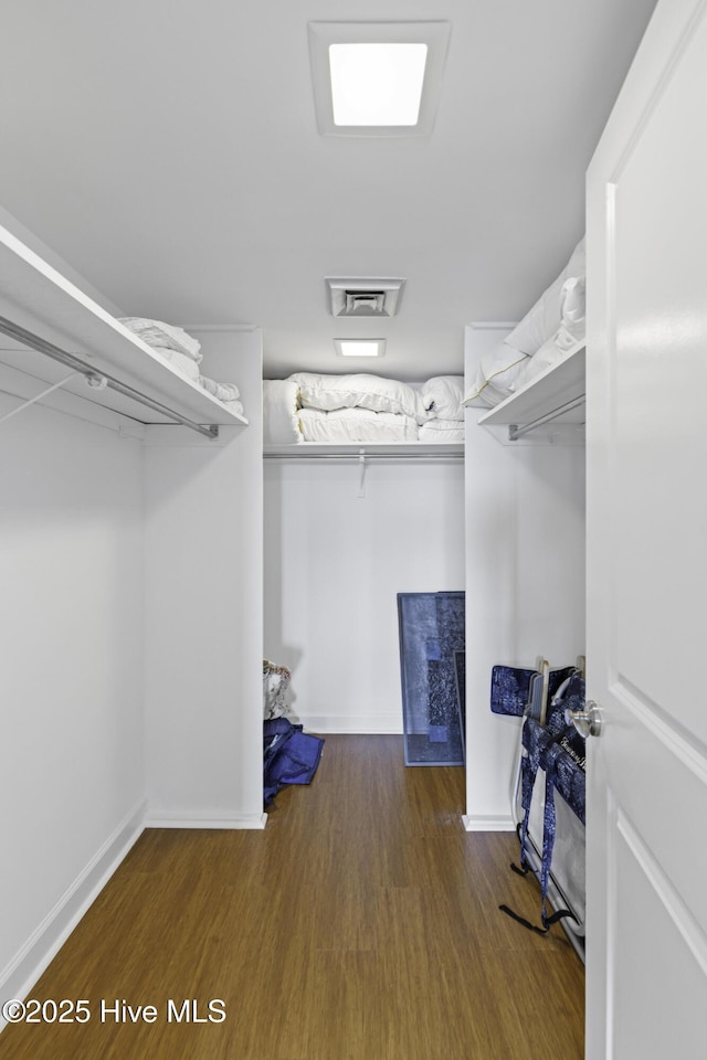 322 Causeway Dr Ste 1001, Wrightsville Beach, NC 28480 - walk in closet featuring wood finished floors and visible vents
