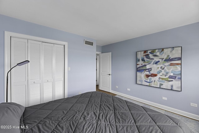 322 Causeway Dr Ste 1001, Wrightsville Beach, NC 28480 - bedroom with visible vents, a closet, and baseboards