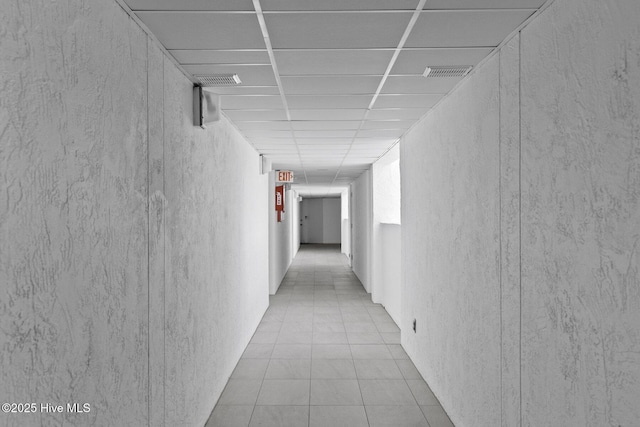 322 Causeway Dr Ste 1001, Wrightsville Beach, NC 28480 - corridor with a textured wall, tile patterned flooring, and visible vents
