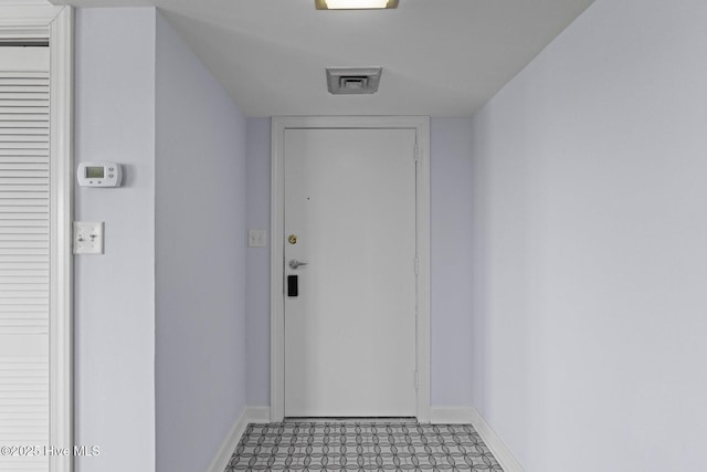 322 Causeway Dr Ste 1001, Wrightsville Beach, NC 28480 - entryway featuring baseboards