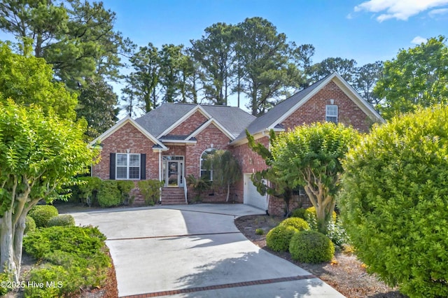 154 Windsor Cir SW, Ocean Isle Beach, NC 28469 - view of front of home with brick siding and concrete driveway