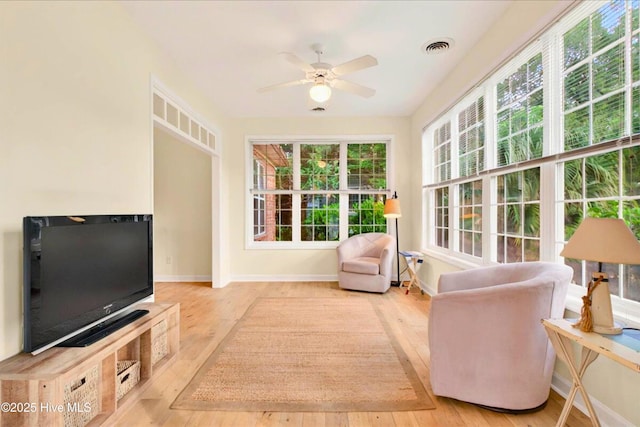 154 Windsor Cir SW, Ocean Isle Beach, NC 28469 - living room featuring baseboards, hardwood / wood-style floors, and a ceiling fan