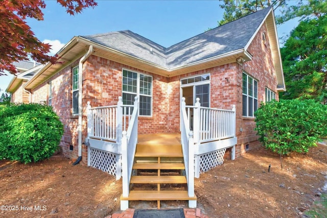 154 Windsor Cir SW, Ocean Isle Beach, NC 28469 - view of front of house with roof with shingles and brick siding