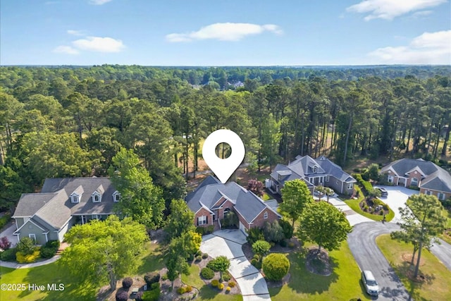 154 Windsor Cir SW, Ocean Isle Beach, NC 28469 - aerial view of residential area with a heavily wooded area