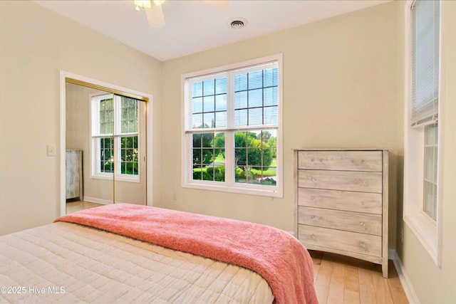 154 Windsor Cir SW, Ocean Isle Beach, NC 28469 - bedroom featuring light wood-type flooring, baseboards, and ceiling fan