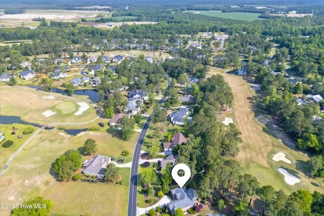 154 Windsor Cir SW, Ocean Isle Beach, NC 28469 - aerial overview of property's location with nearby suburban area, a local golf course, and a large body of water