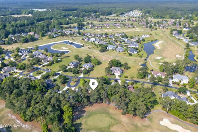 154 Windsor Cir SW, Ocean Isle Beach, NC 28469 - aerial overview of property's location featuring a large body of water, a golf course, and nearby suburban area