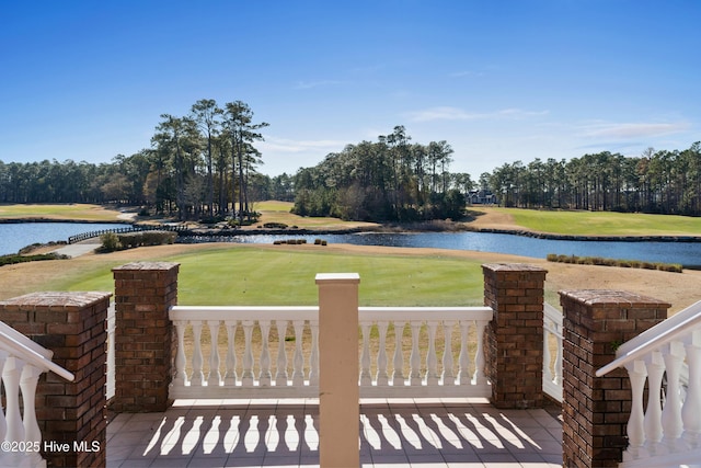 154 Windsor Cir SW, Ocean Isle Beach, NC 28469 - view of grassy yard with a water view, view of golf course, and view of wooded area
