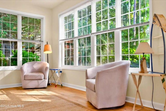 154 Windsor Cir SW, Ocean Isle Beach, NC 28469 - sitting room with baseboards, healthy amount of natural light, and wood finished floors