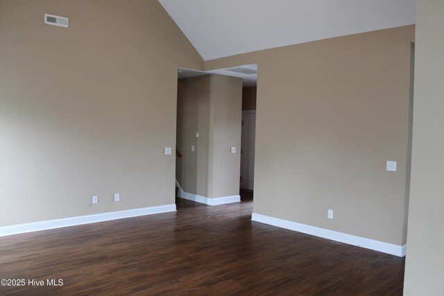 107 Pinyon Ln, Ayden, NC 28513 - spare room with dark wood-type flooring, visible vents, baseboards, and high vaulted ceiling