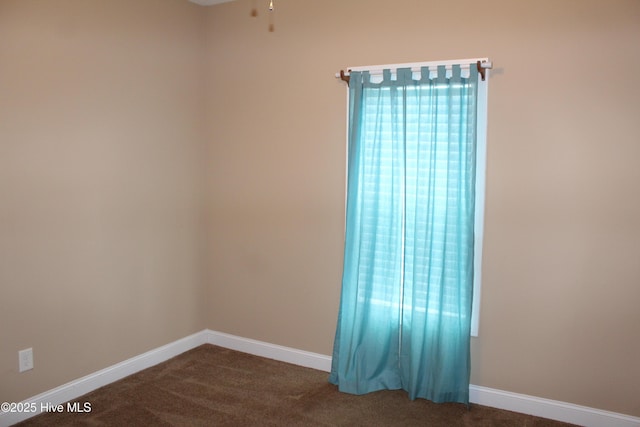 107 Pinyon Ln, Ayden, NC 28513 - empty room featuring dark colored carpet, baseboards, and ceiling fan