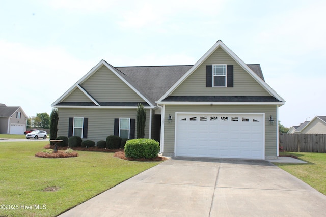 107 Pinyon Ln, Ayden, NC 28513 - view of front of property featuring a front yard, fence, a shingled roof, and concrete driveway