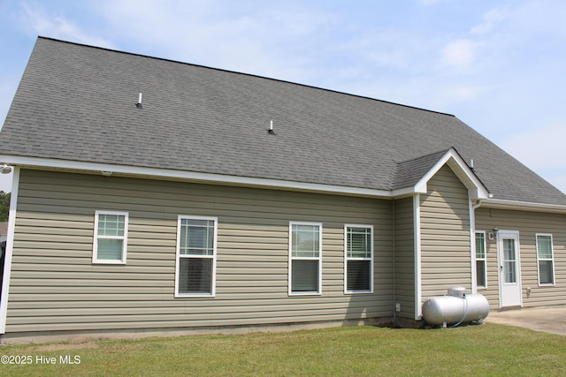 107 Pinyon Ln, Ayden, NC 28513 - rear view of house featuring roof with shingles and a lawn