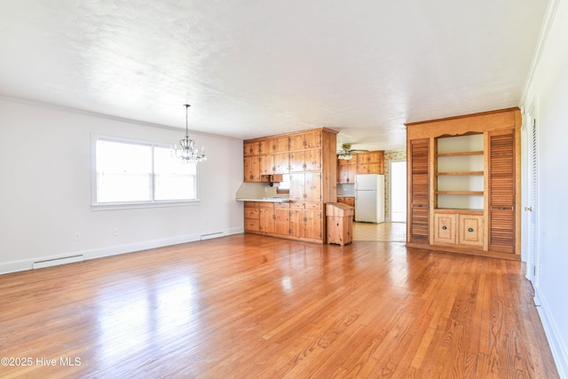 unfurnished living room featuring visible vents, baseboards, light wood-type flooring, and ceiling fan with notable chandelier
