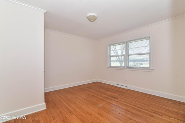 spare room with visible vents, crown molding, and light wood-style flooring