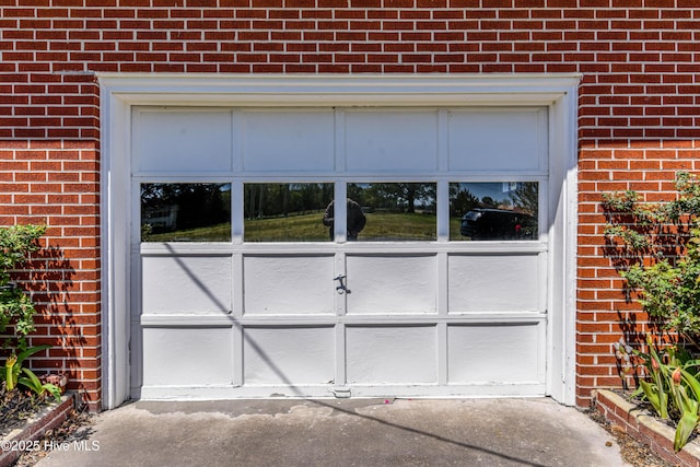 garage with aphalt driveway