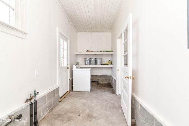 clothes washing area featuring washer / clothes dryer and laundry area