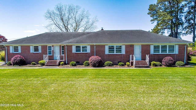 ranch-style home featuring a front yard and brick siding