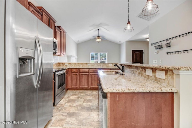 kitchen featuring a sink, a ceiling fan, a peninsula, brown cabinets, and stainless steel appliances