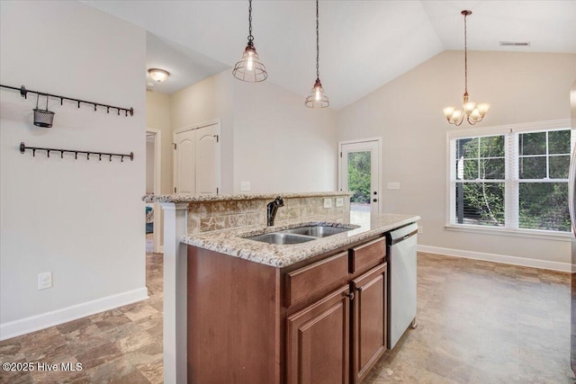 kitchen with stainless steel dishwasher, brown cabinetry, a sink, and pendant lighting
