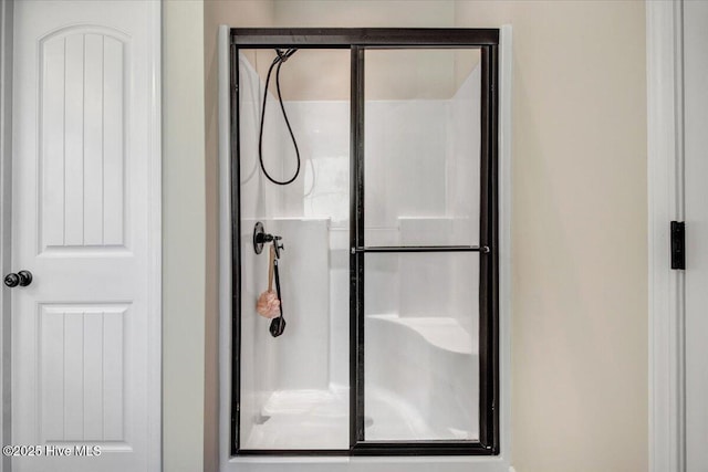 bathroom with a shower stall
