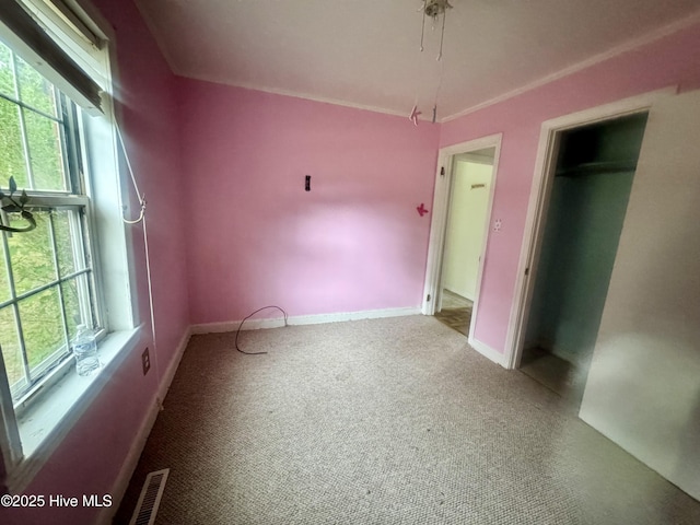 1505 Dover Fort Barnwell Rd, Dover, NC 28526 - unfurnished bedroom with multiple windows, carpet flooring, and baseboards