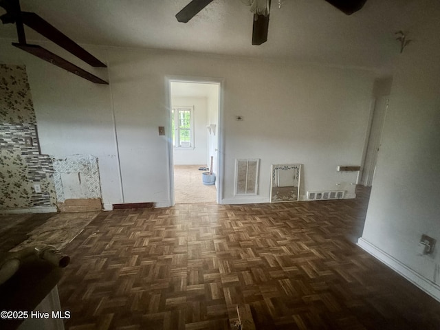 1505 Dover Fort Barnwell Rd, Dover, NC 28526 - unfurnished living room featuring a ceiling fan and baseboards