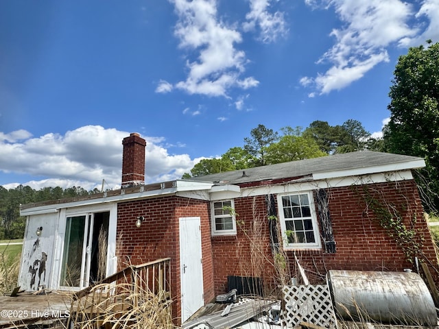 1505 Dover Fort Barnwell Rd, Dover, NC 28526 - back of house featuring brick siding and a chimney