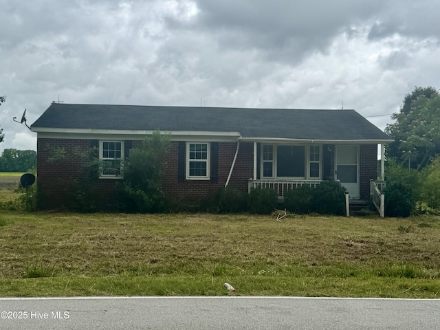 1505 Dover Fort Barnwell Rd, Dover, NC 28526 - ranch-style house featuring brick siding, a front yard, and a porch