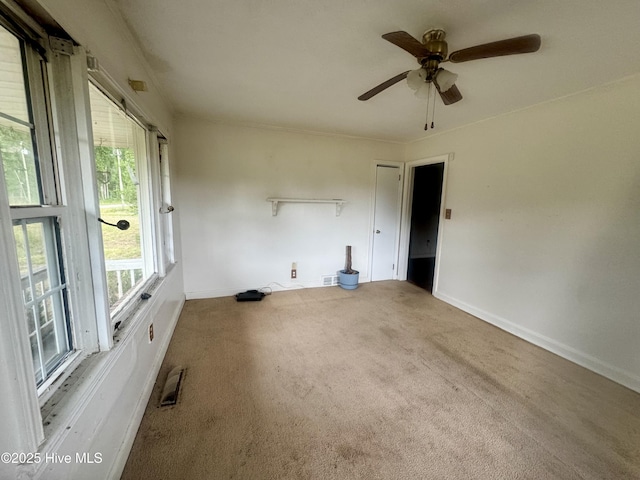 1505 Dover Fort Barnwell Rd, Dover, NC 28526 - spare room featuring carpet floors, ceiling fan, and baseboards