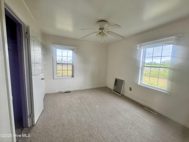 1505 Dover Fort Barnwell Rd, Dover, NC 28526 - empty room featuring a ceiling fan, carpet flooring, and baseboards
