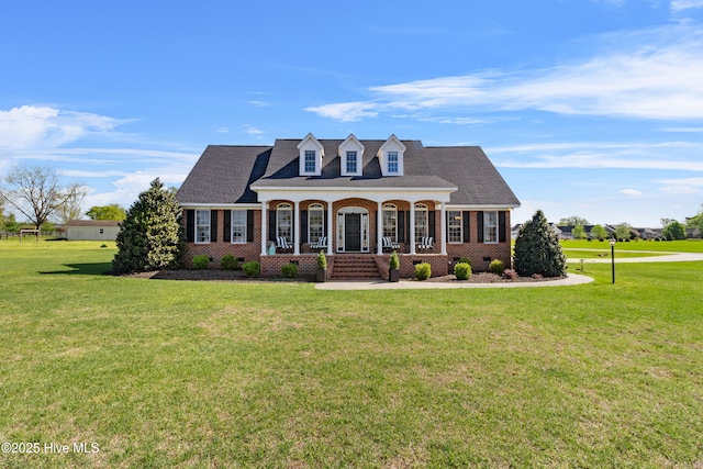 103 Arabian Cir, Beulaville, NC 28518 - cape cod house with brick siding, a porch, a front yard, and crawl space