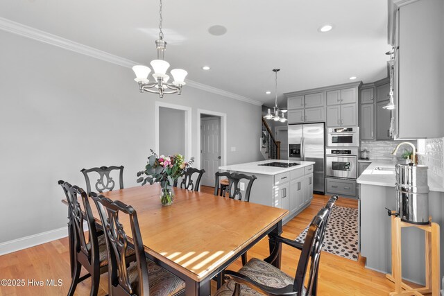 103 Arabian Cir, Beulaville, NC 28518 - dining room with a chandelier, ornamental molding, light wood-style flooring, recessed lighting, and baseboards