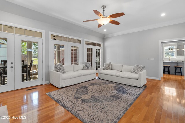 103 Arabian Cir, Beulaville, NC 28518 - living area with french doors, ceiling fan, light wood-style flooring, crown molding, and recessed lighting